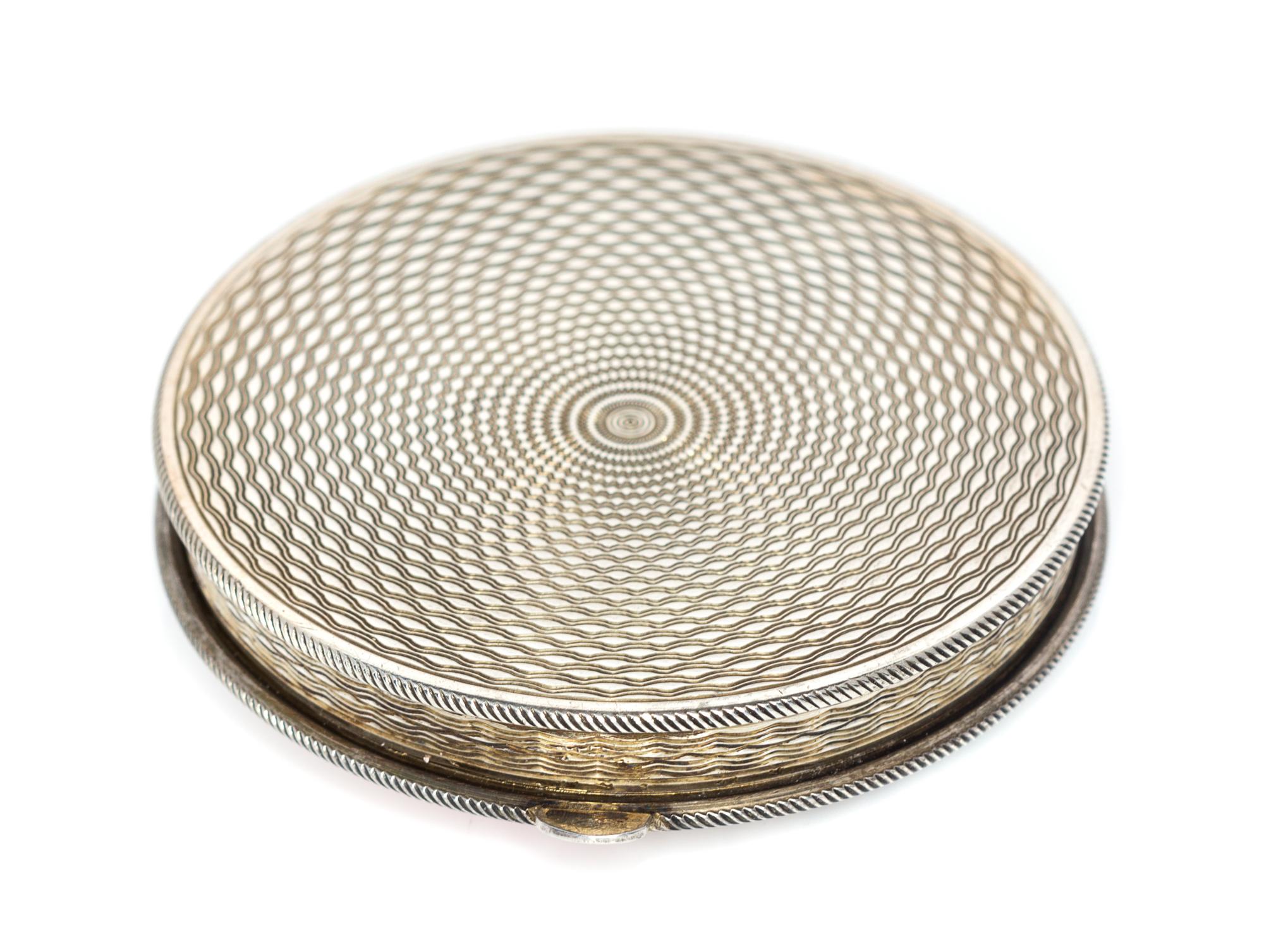 A Continental Silver and Enamel Compact, Import Mark GS, London, 1925, the lid enameled with bamboo shoots, dragonflies and four Chines