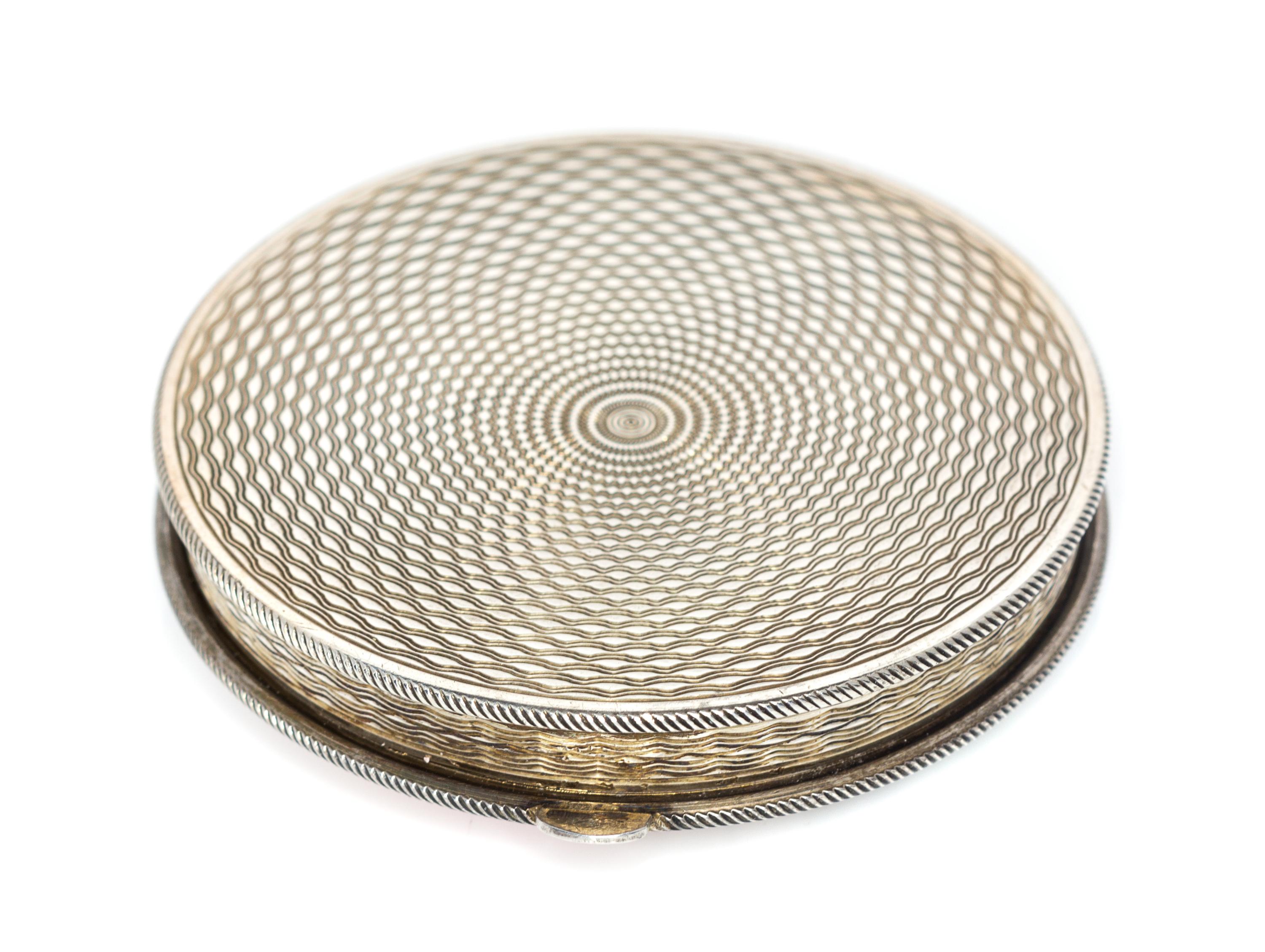 A Continental Silver and Enamel Compact, Import Mark GS, London, 1925, the lid enameled with bamboo shoots, dragonflies and four Chines