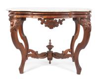 A Victorian Walnut Parlor Table Height 27 x width 35 x depth 24 inches. — 19TH/20TH CENTURY