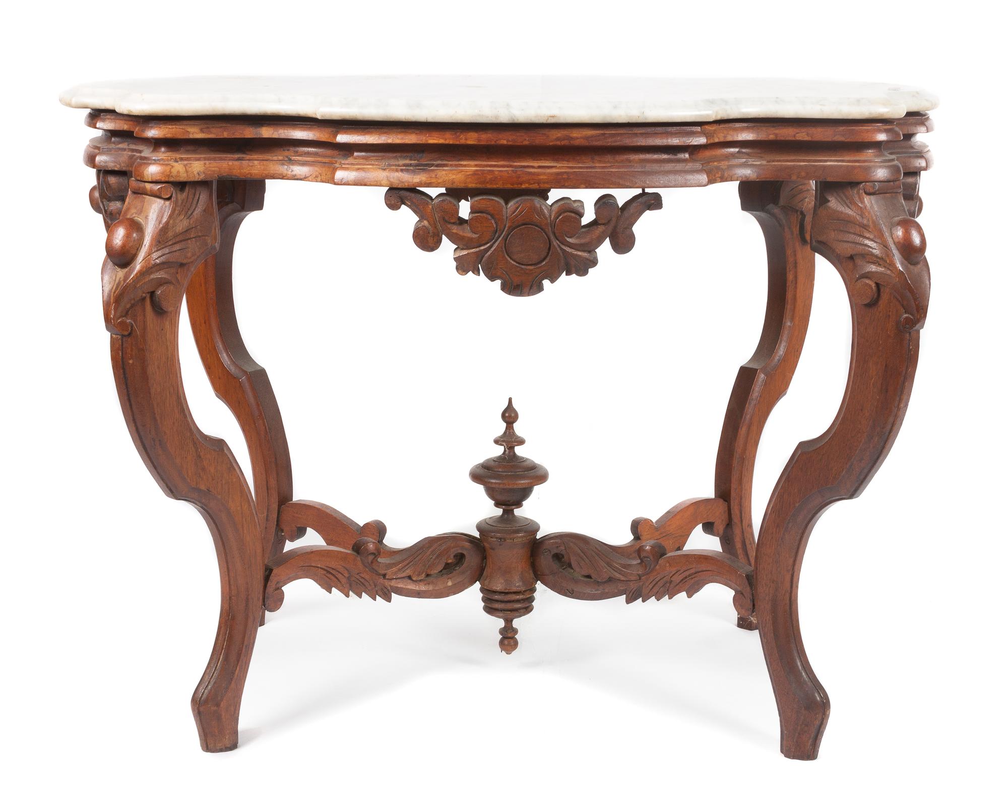 A Victorian Walnut Parlor Table Height 27 x width 35 x depth 24 inches. — 19TH/20TH CENTURY