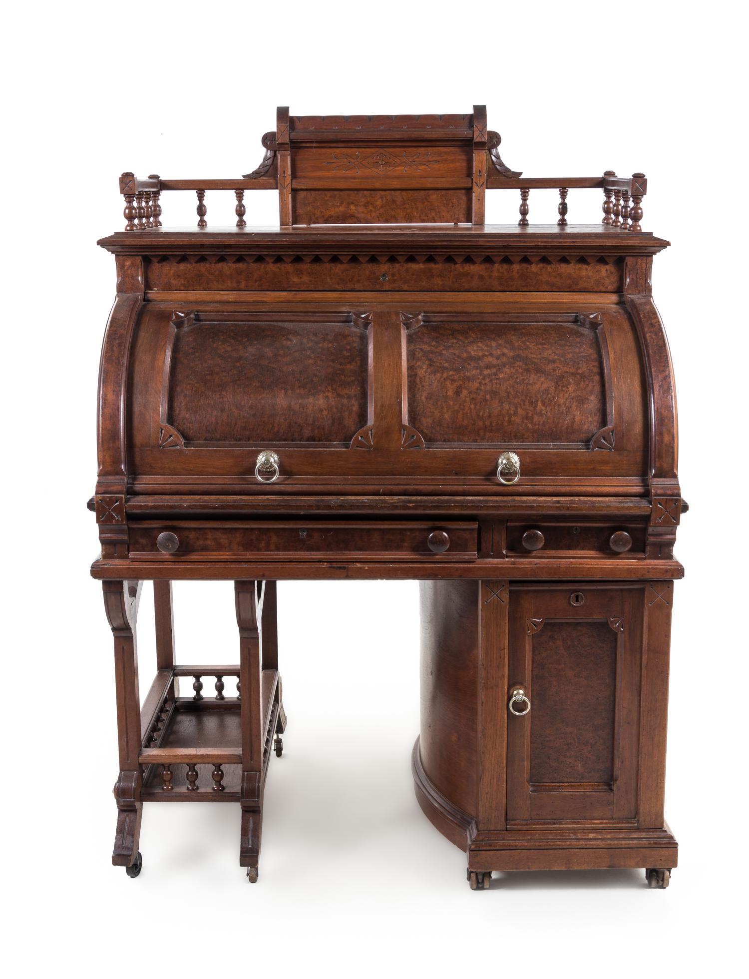 A Wooton Patent Walnut Rotary Desk Height 63 5/8 x width 45 1/2 x depth 29 3/8 inches. — SECOND HALF 19TH CENTURY