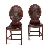 A Pair of Regency Style Mahogany and Polychrome Decorated Hall Chairs