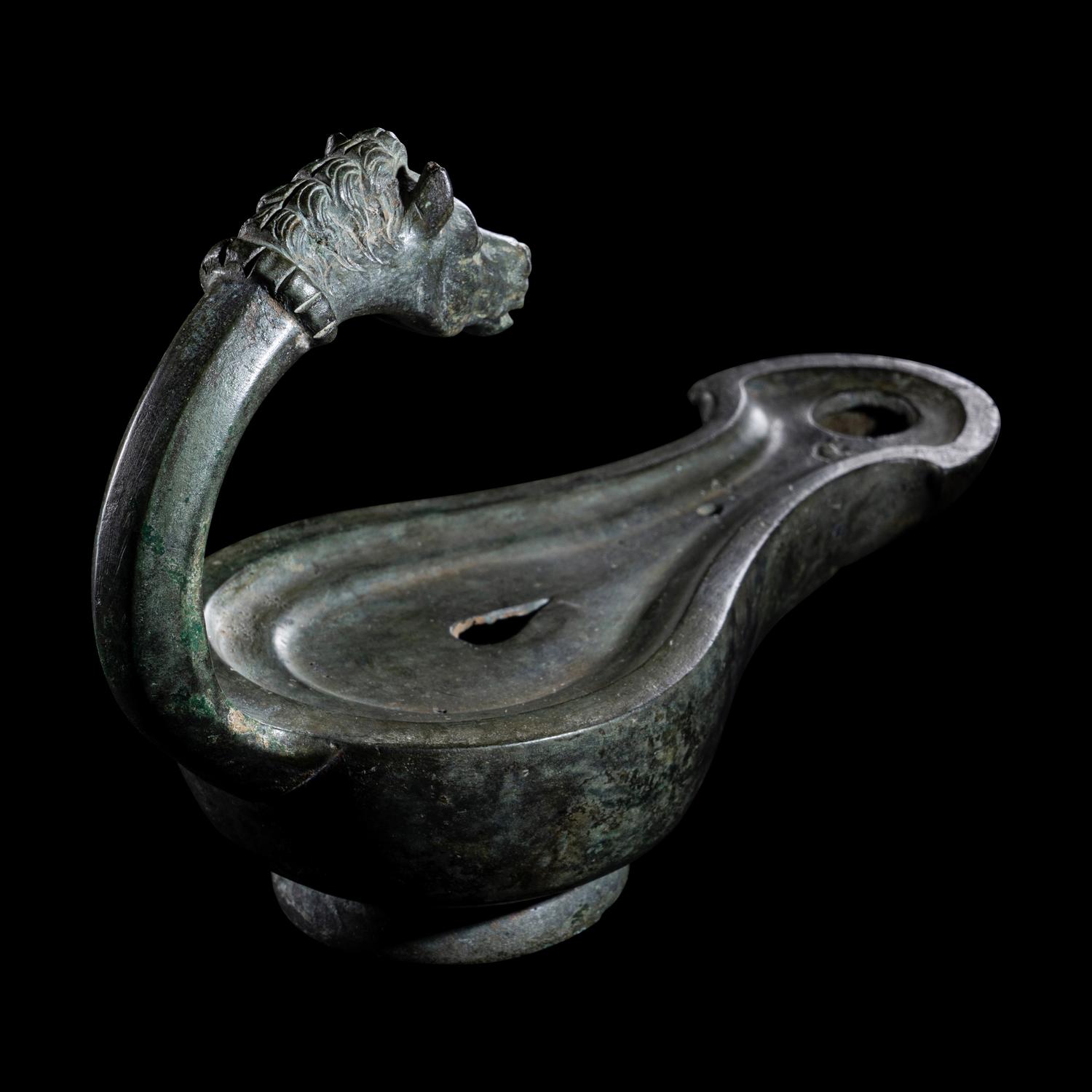 A Roman Bronze Horse Head Oil Lamp
