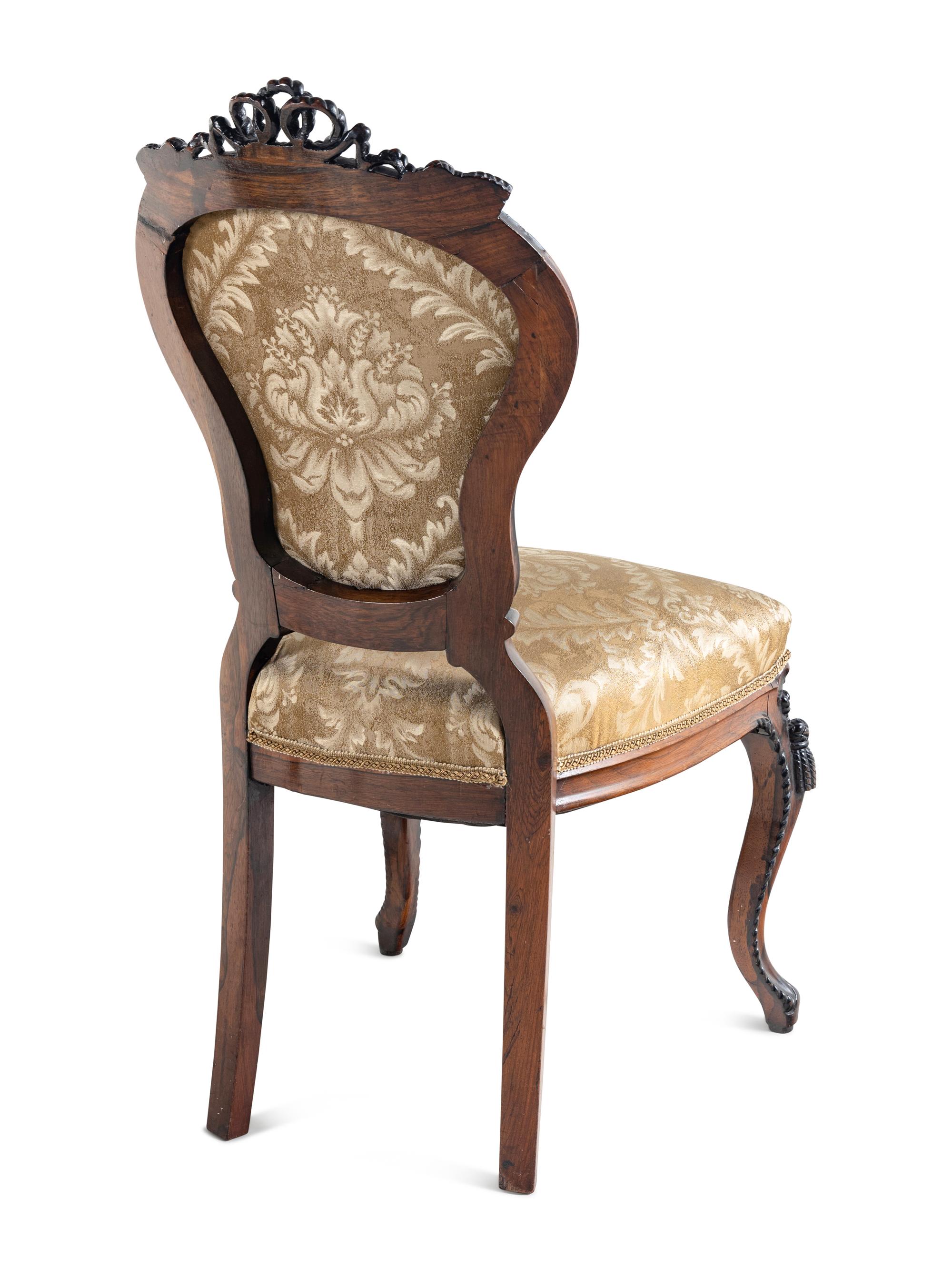A Set of Four Rococo Revival Carved Balloon-Back Side Chairs