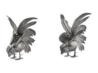 A Pair of Continental Silvered-Metal Roosters