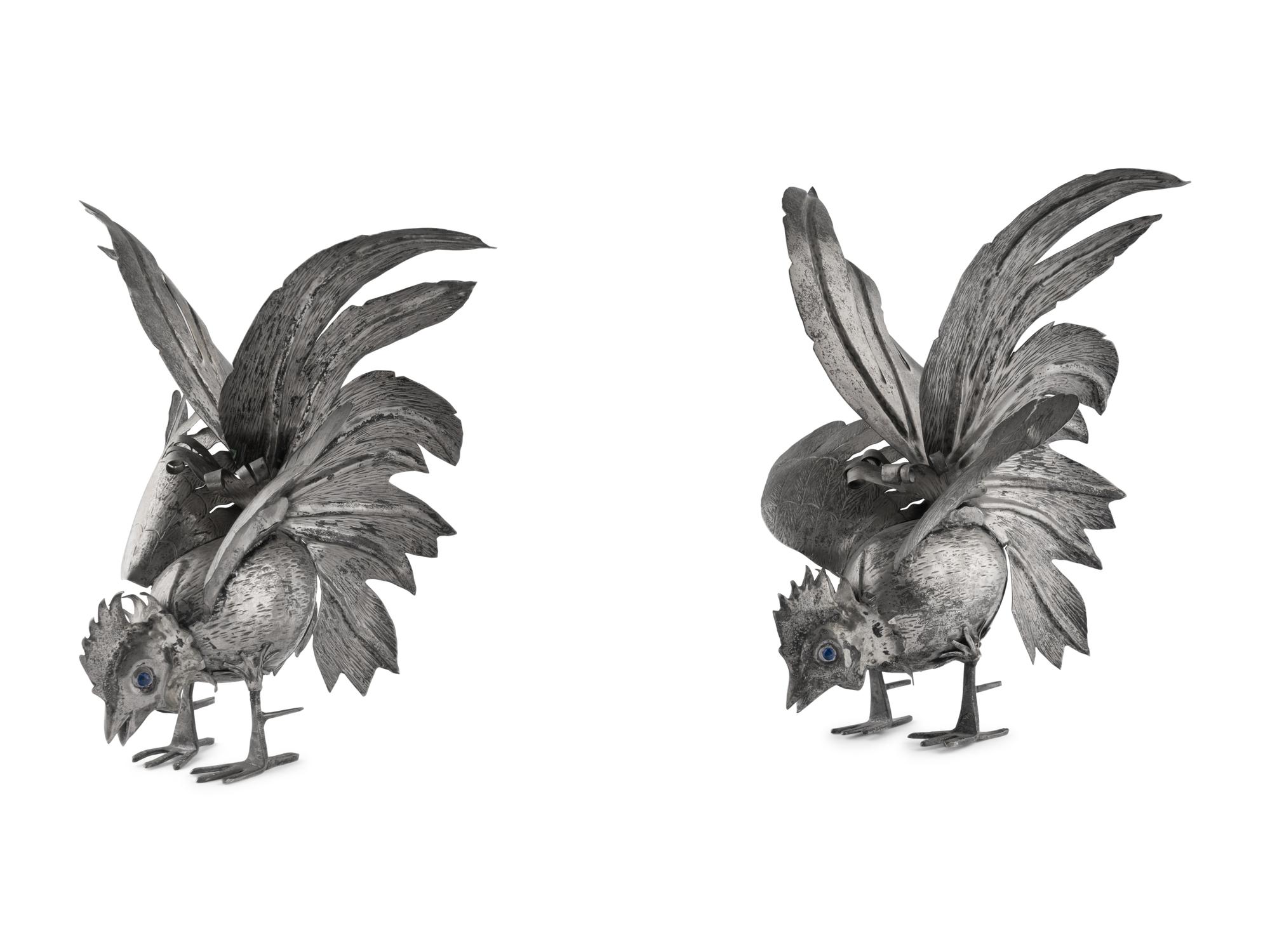 A Pair of Continental Silvered-Metal Roosters