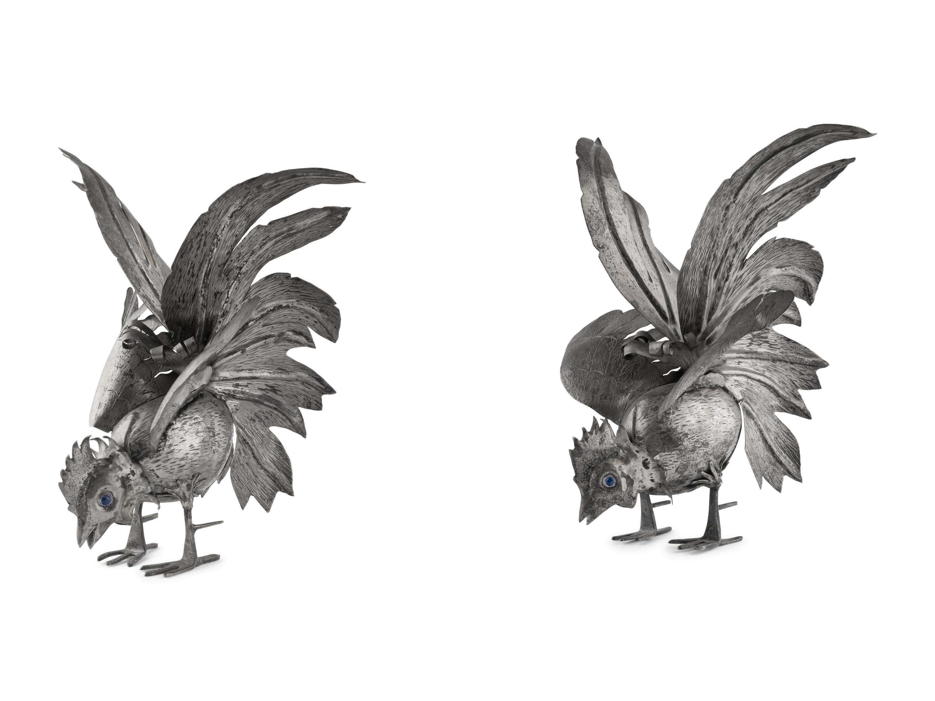 A Pair of Continental Silvered-Metal Roosters