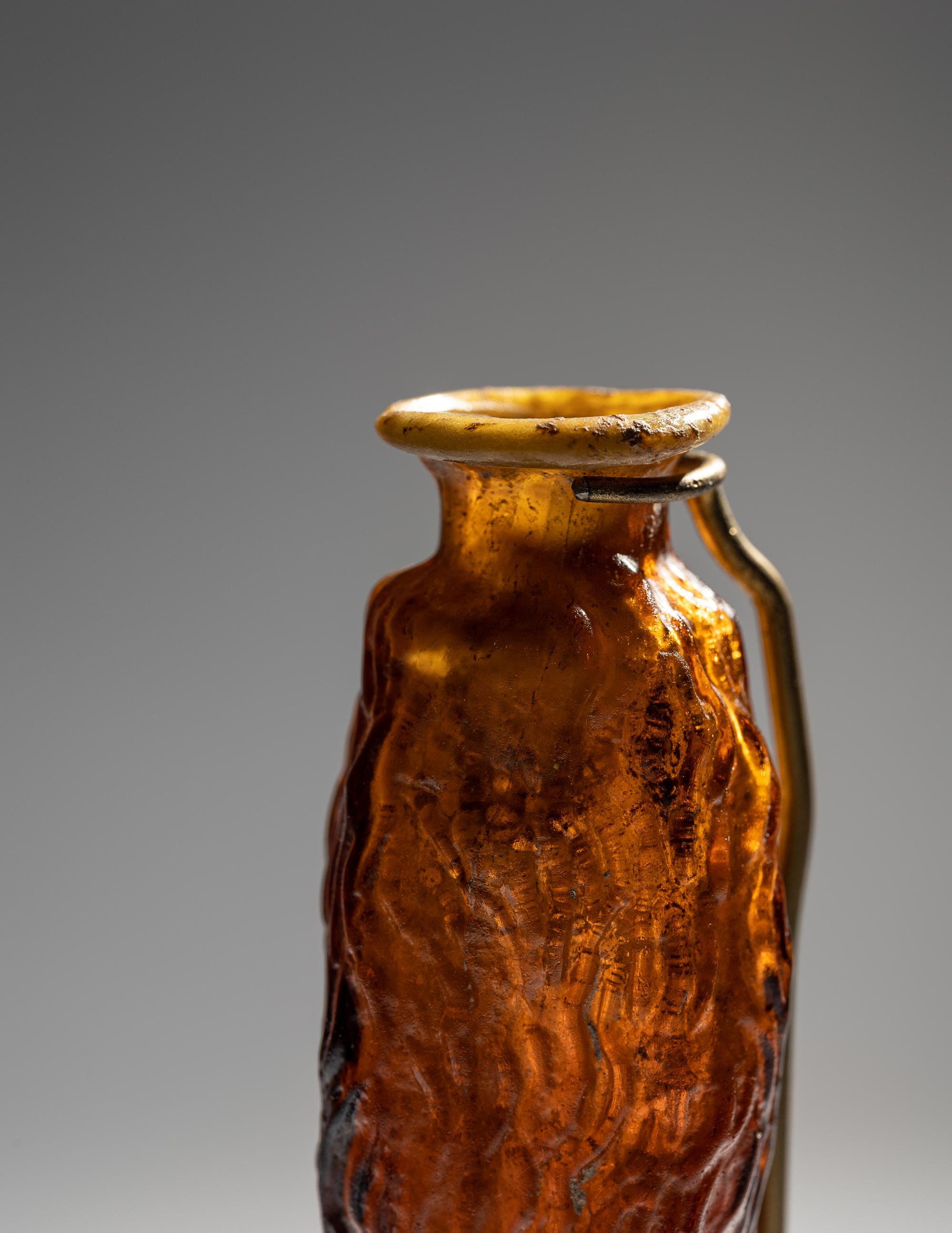 A Roman Amber Glass Date Flask