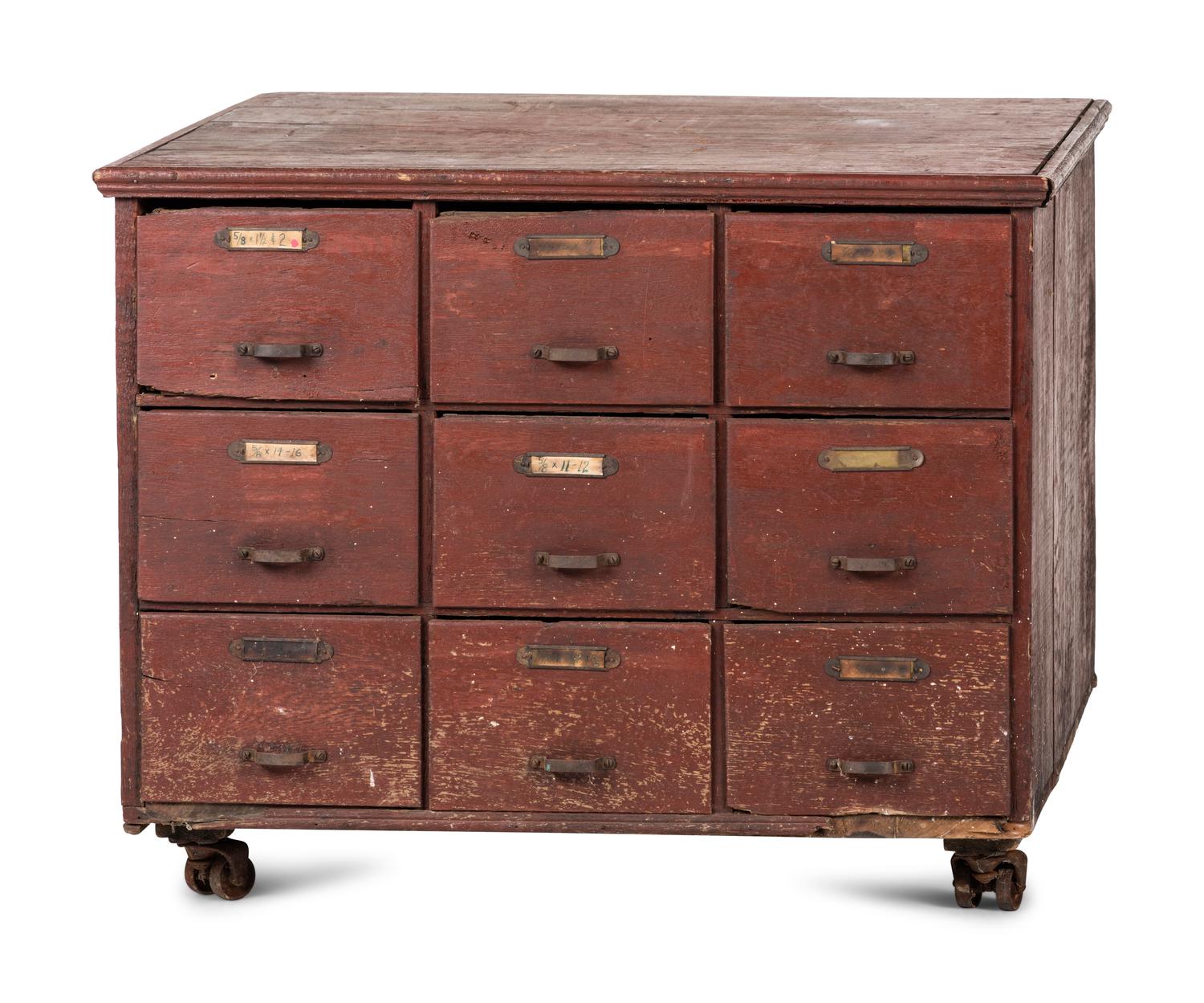 A Red Painted Pine Storage Chest on Casters