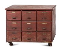 A Red Painted Pine Storage Chest on Casters