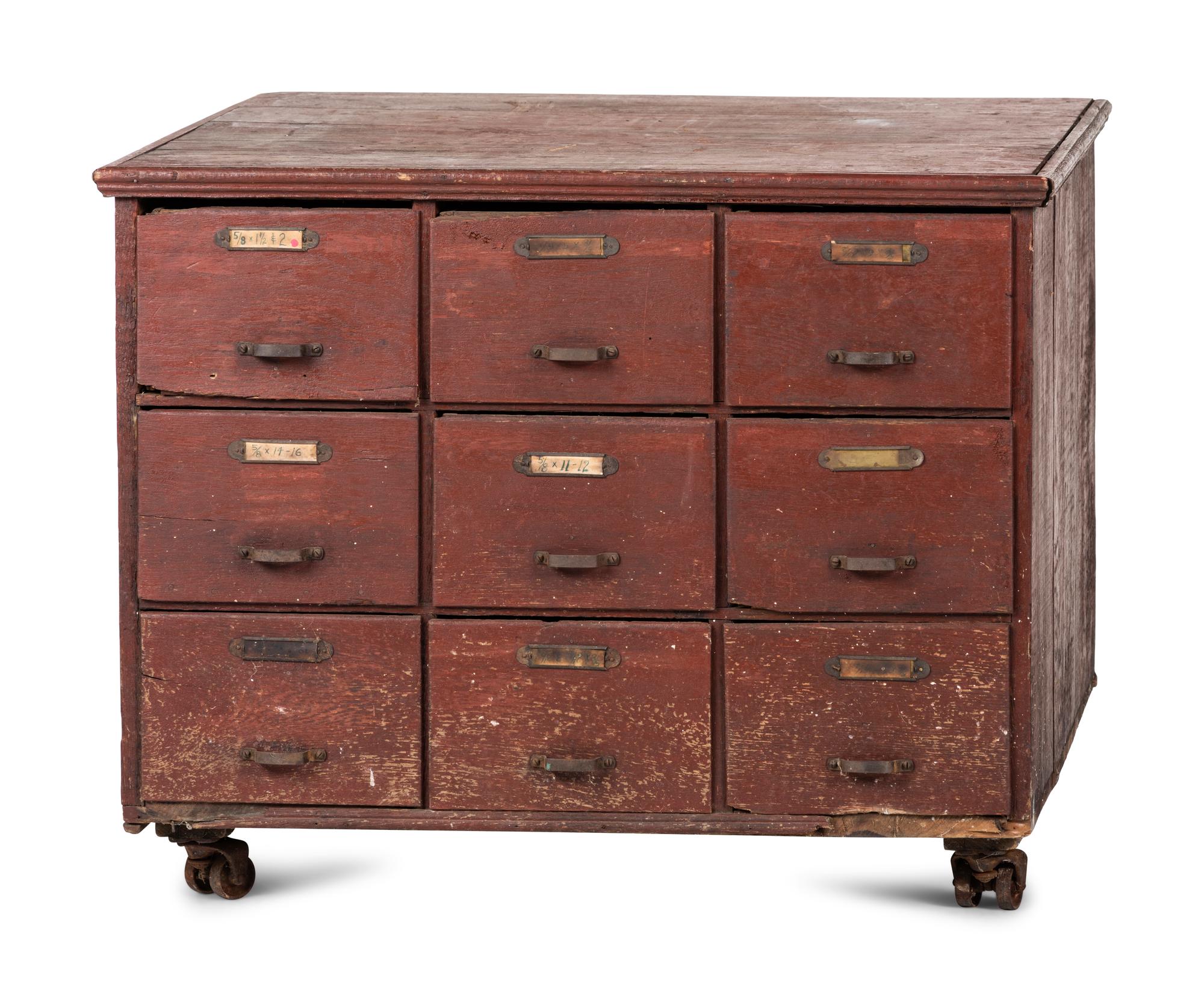 A Red Painted Pine Storage Chest on Casters