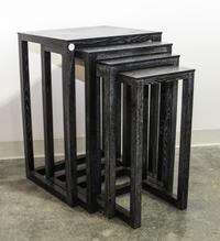A Set of Four Black Cerused Wood Nesting Tables. Height 27 1/2 inches.