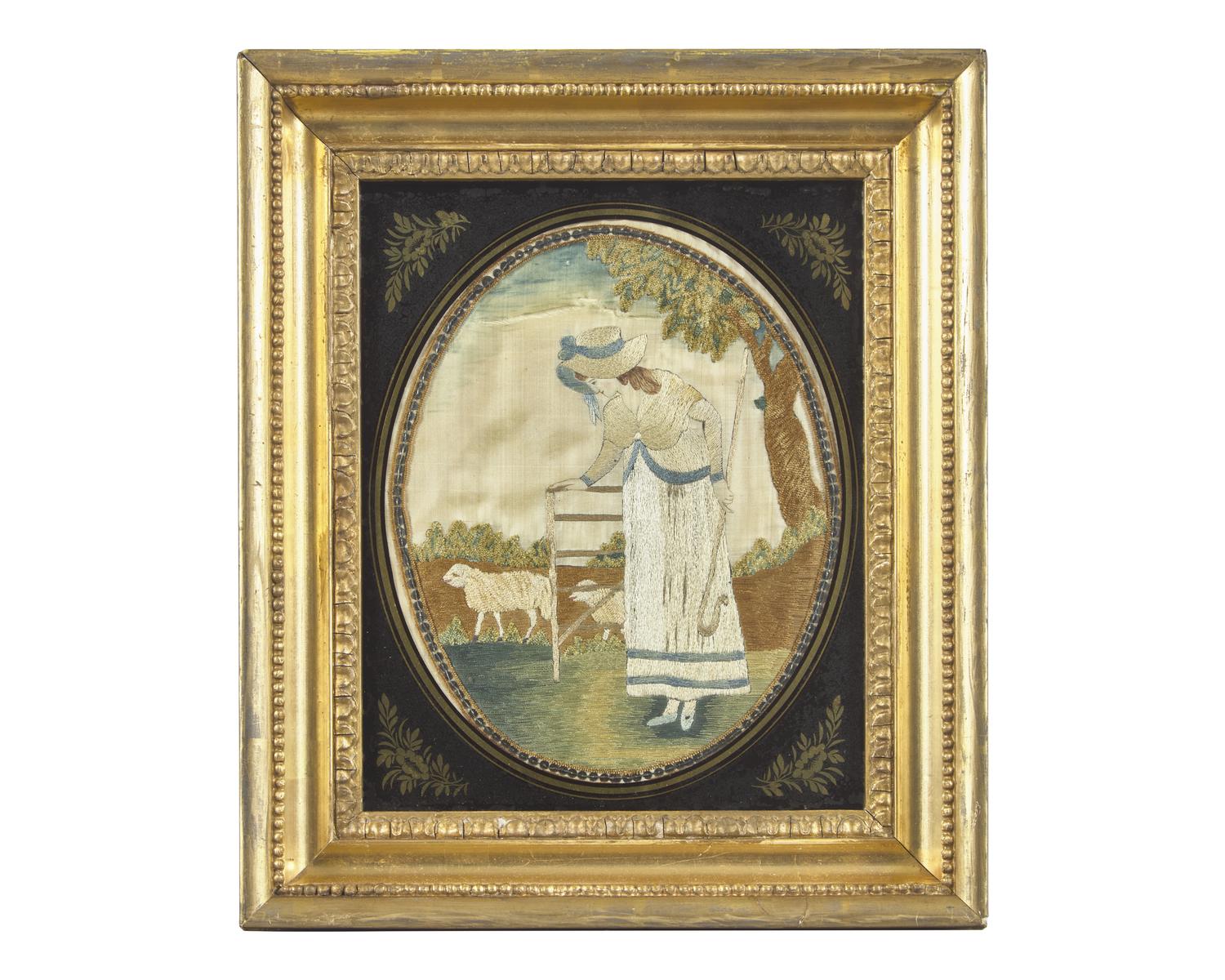 A George III Needlework Picture Depicting a Shepherdess with Sheep