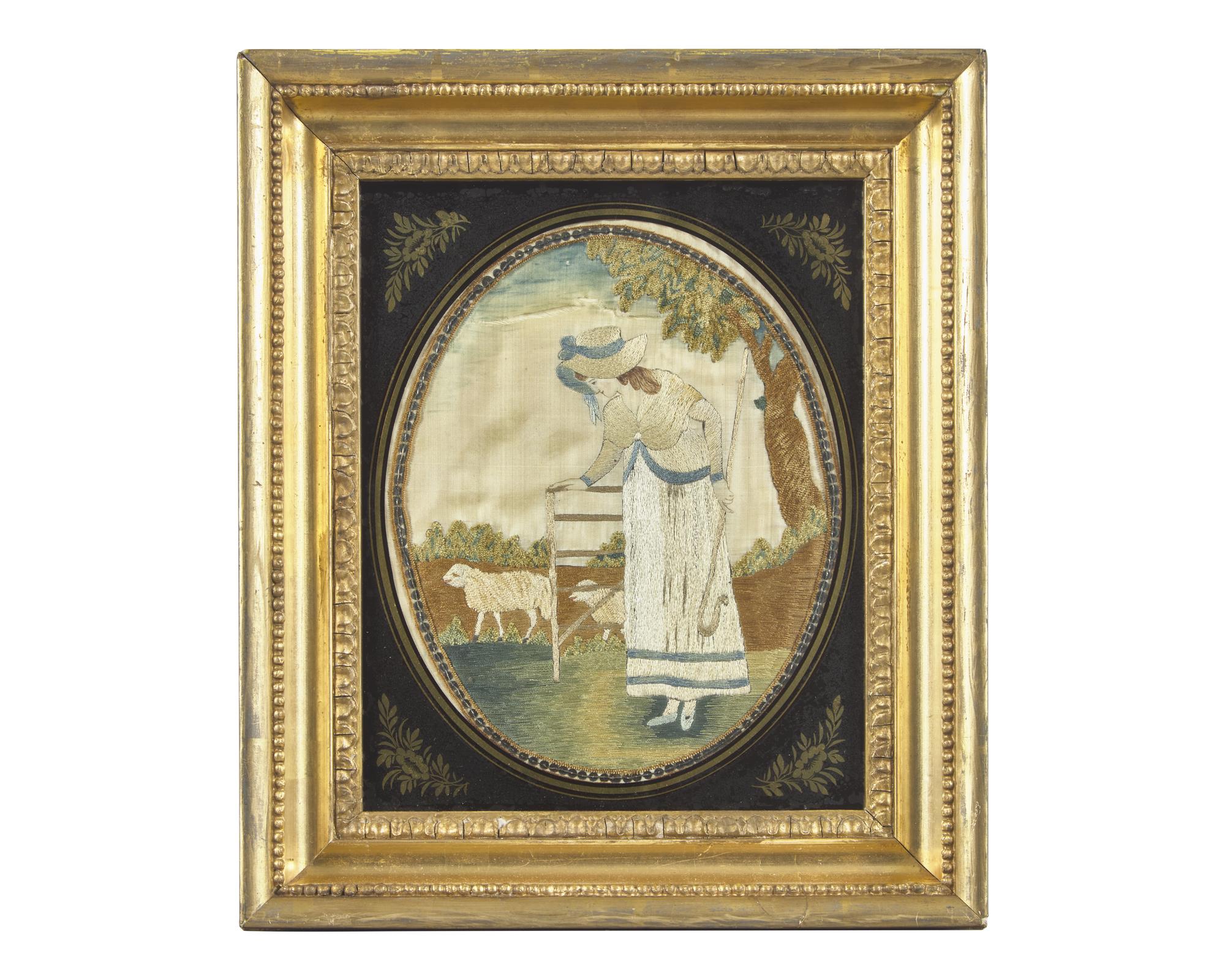 A George III Needlework Picture Depicting a Shepherdess with Sheep