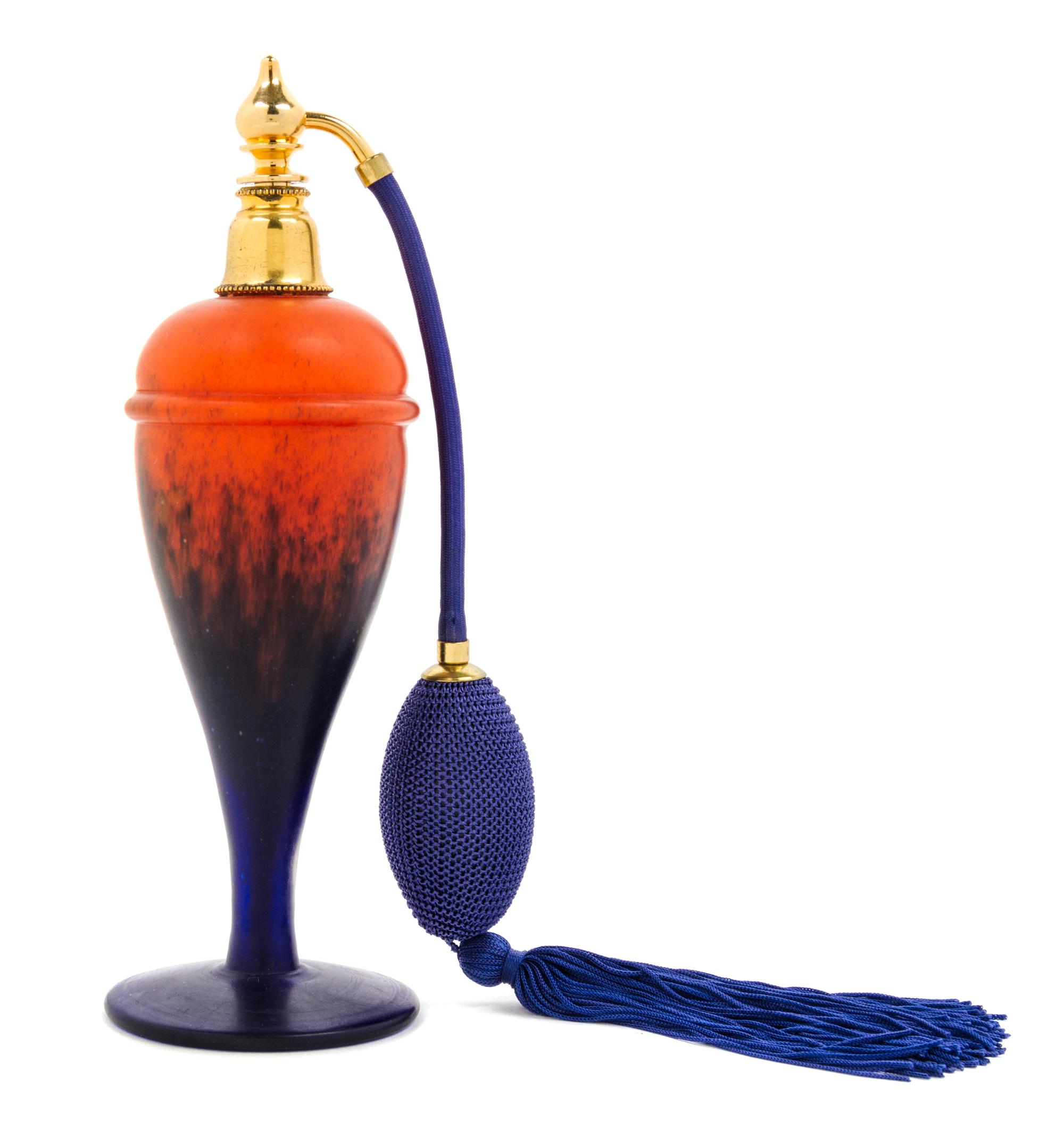 A Modeled Glass Perfume Bottle Height 7 3/4 inches.