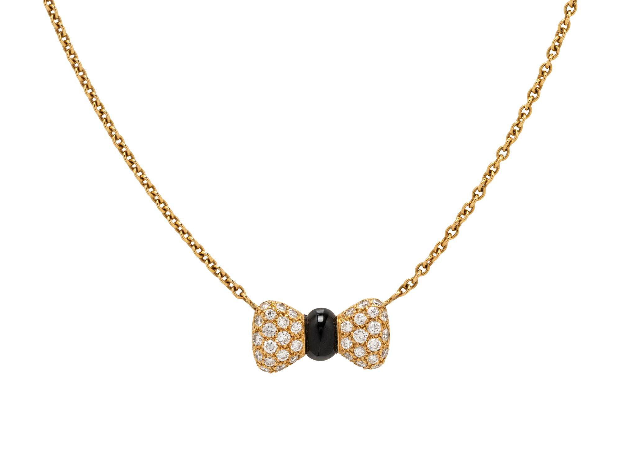 VAN CLEEF & ARPELS, YELLOW GOLD, DIAMOND AND ONYX BOW NECKLACE