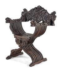 An Italian Renaissance Revival Carved Walnut Savonarola Armchair