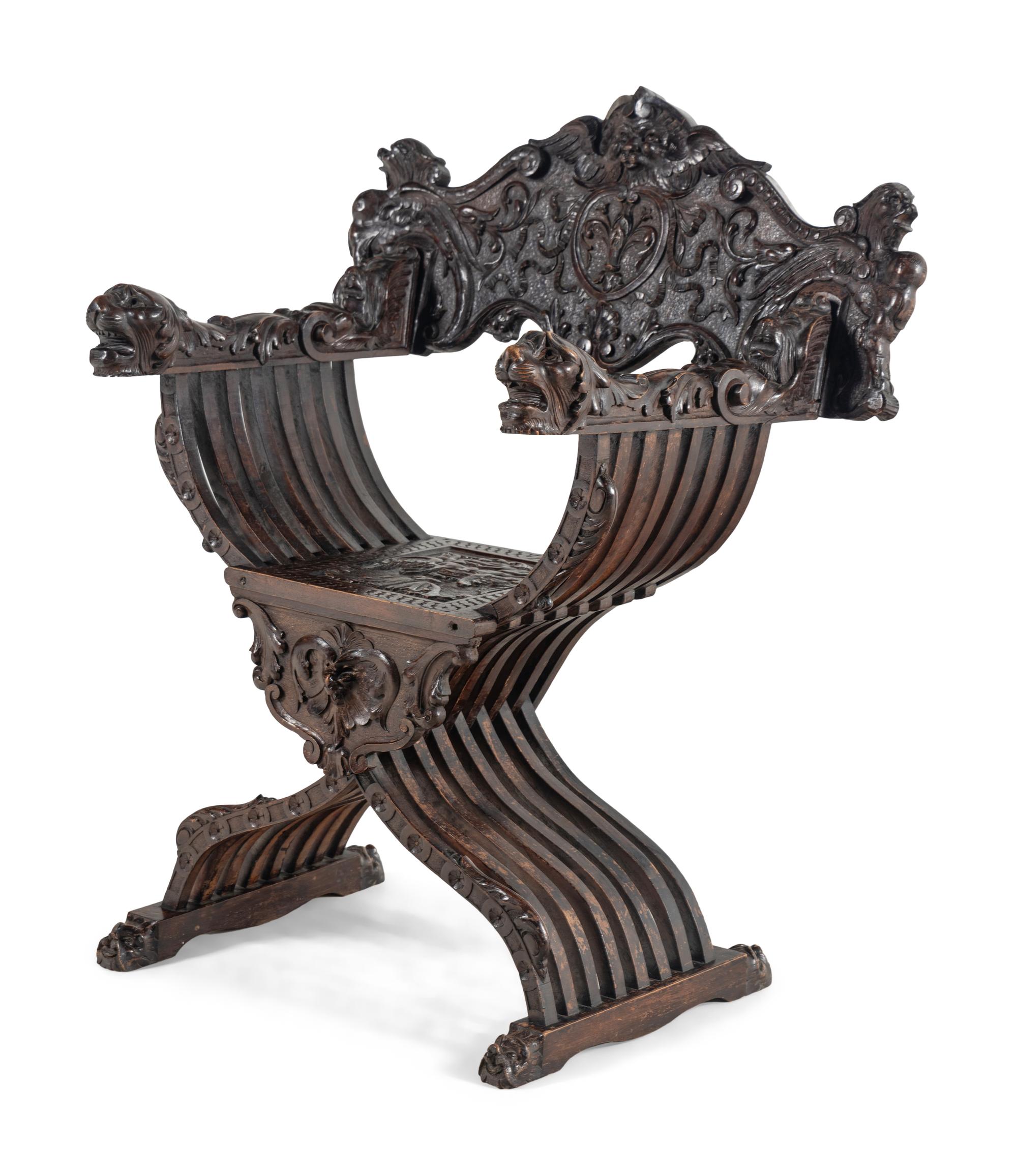 An Italian Renaissance Revival Carved Walnut Savonarola Armchair