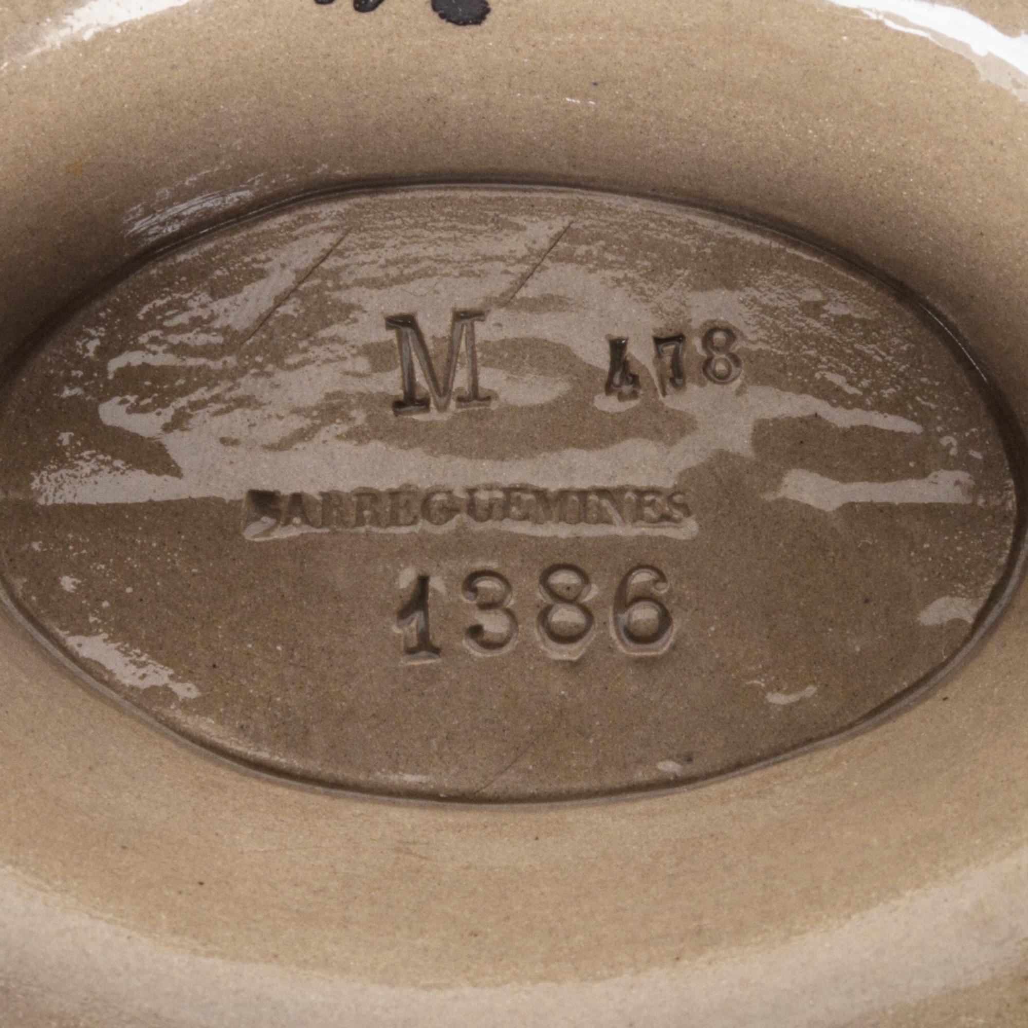 A Sarreguemines Ceramic Pitcher Height 8 3/8 inches.