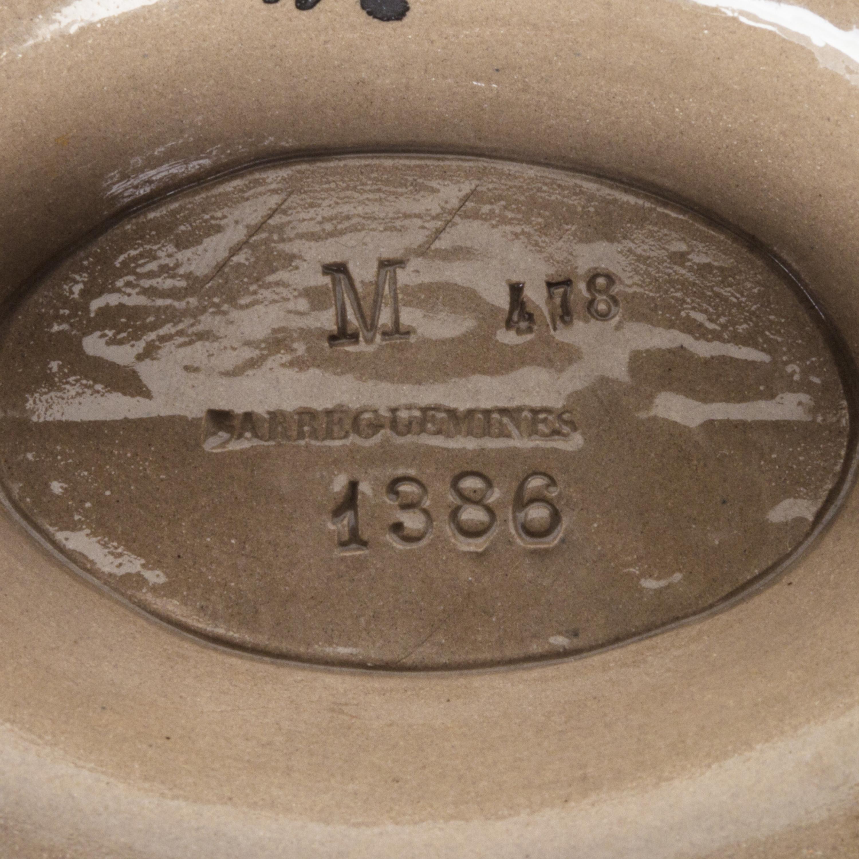 A Sarreguemines Ceramic Pitcher Height 8 3/8 inches.