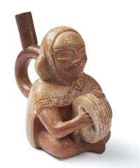 A Moche Stirrup Vessel in the form of a Shaman Drummer