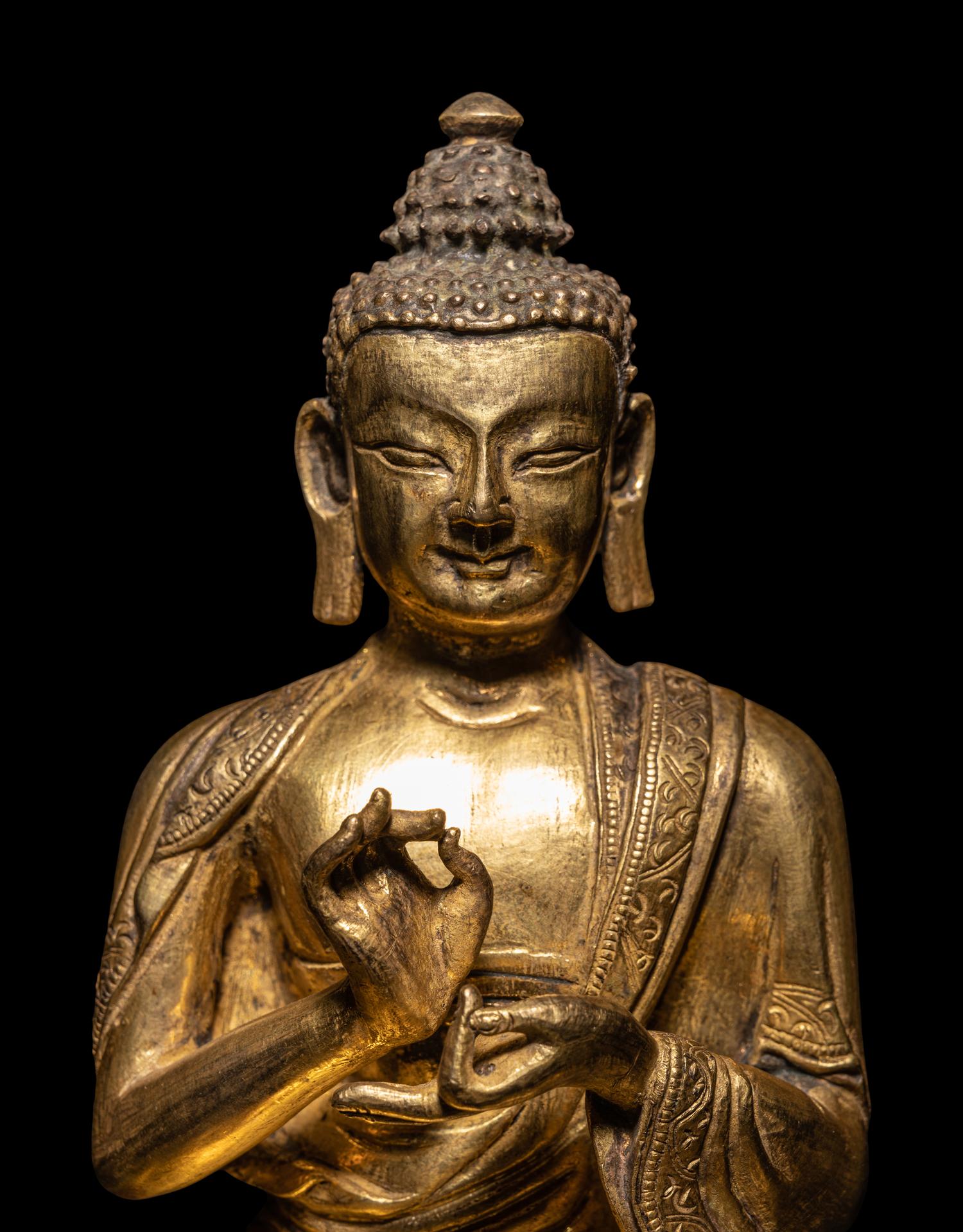 A Sino-Tibetan Gilt Bronze Seated Figure of Buddha Shakyamuni