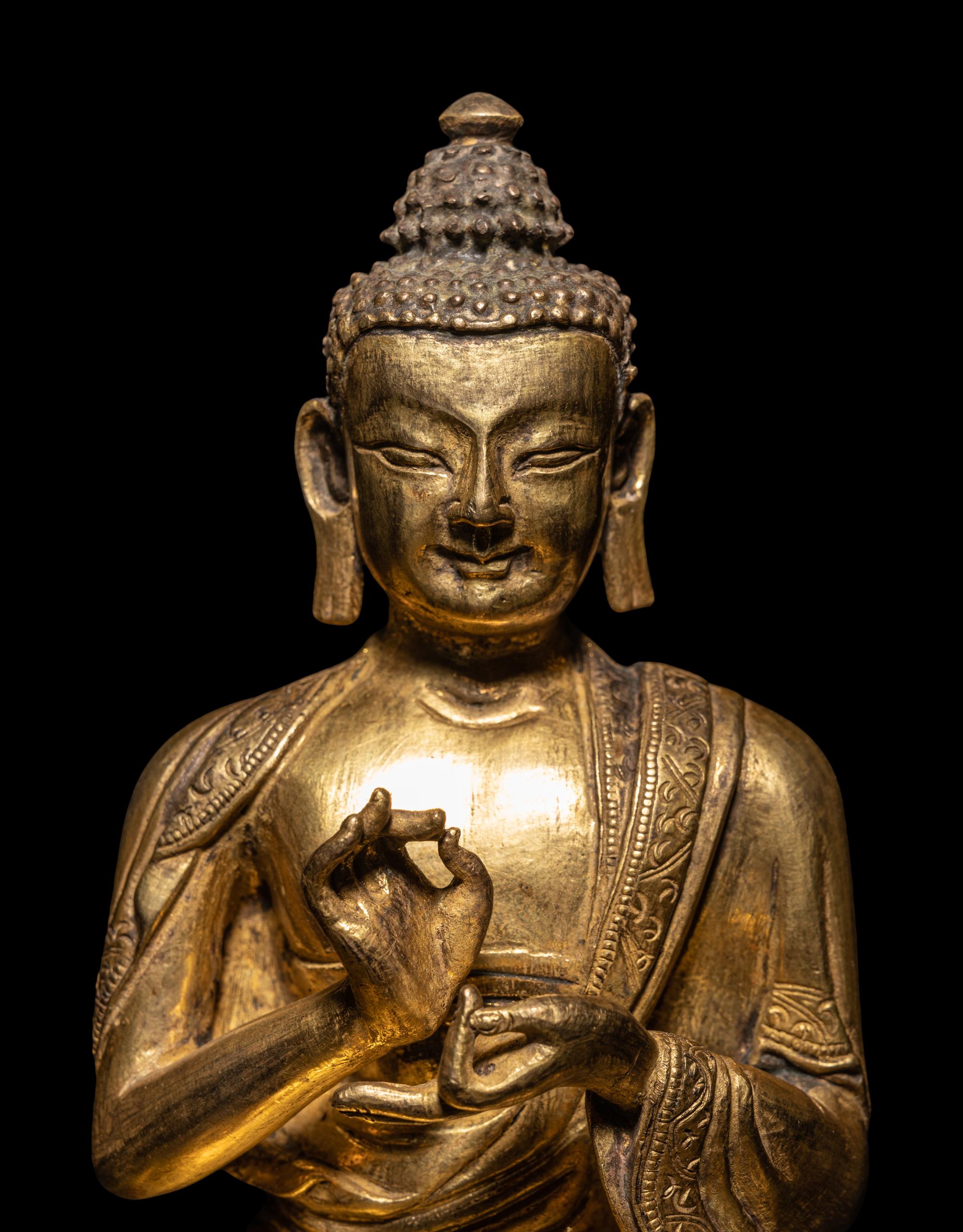 A Sino-Tibetan Gilt Bronze Seated Figure of Buddha Shakyamuni