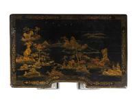 A Chinese Export Black and Gilt Lacquered Kneehole Desk
