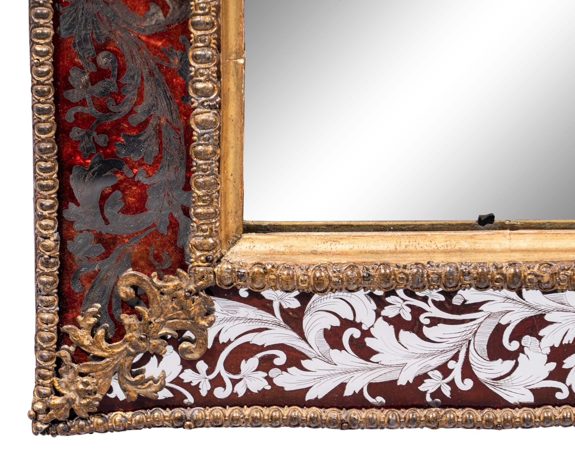 A Swedish Baroque Verre Églomisé and Giltwood Mirror