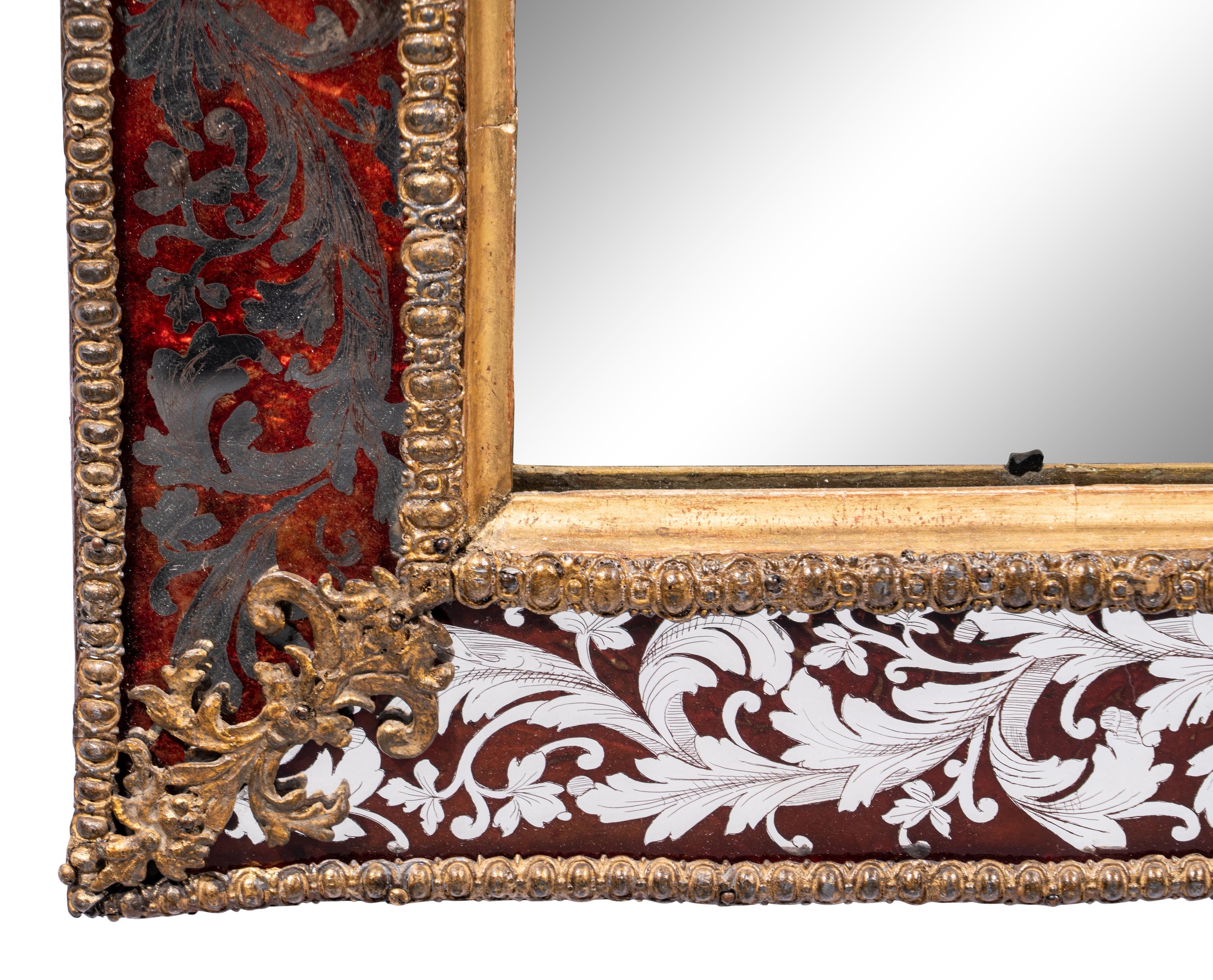 A Swedish Baroque Verre Églomisé and Giltwood Mirror