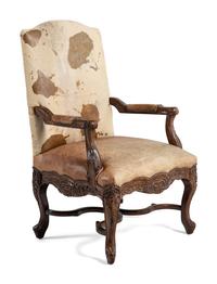 A Pair of Louis XV Style Carved Walnut Fauteuils