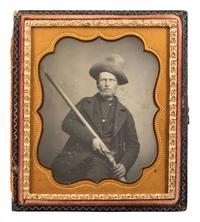 [EARLY PHOTOGRAPHY]. Sixth plate daguerreotype of a tough outdoorsman holding a large flintlock fowler.