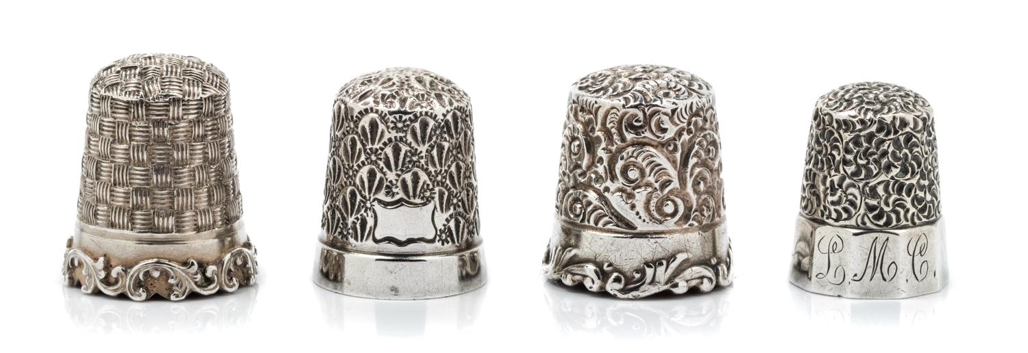 A Group of Four American Silver Thimbles, Goldsmith, Stern & Co., New York, NY and others, comprising an example with a top and body wo