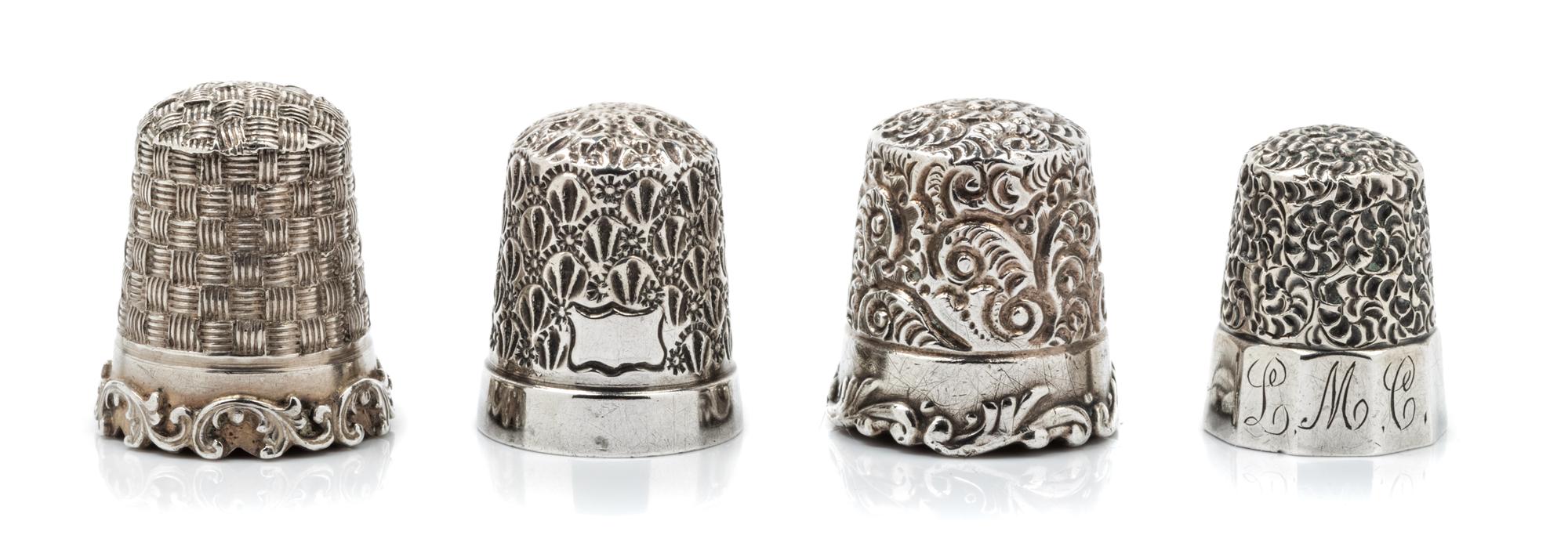 A Group of Four American Silver Thimbles, Goldsmith, Stern & Co., New York, NY and others, comprising an example with a top and body wo