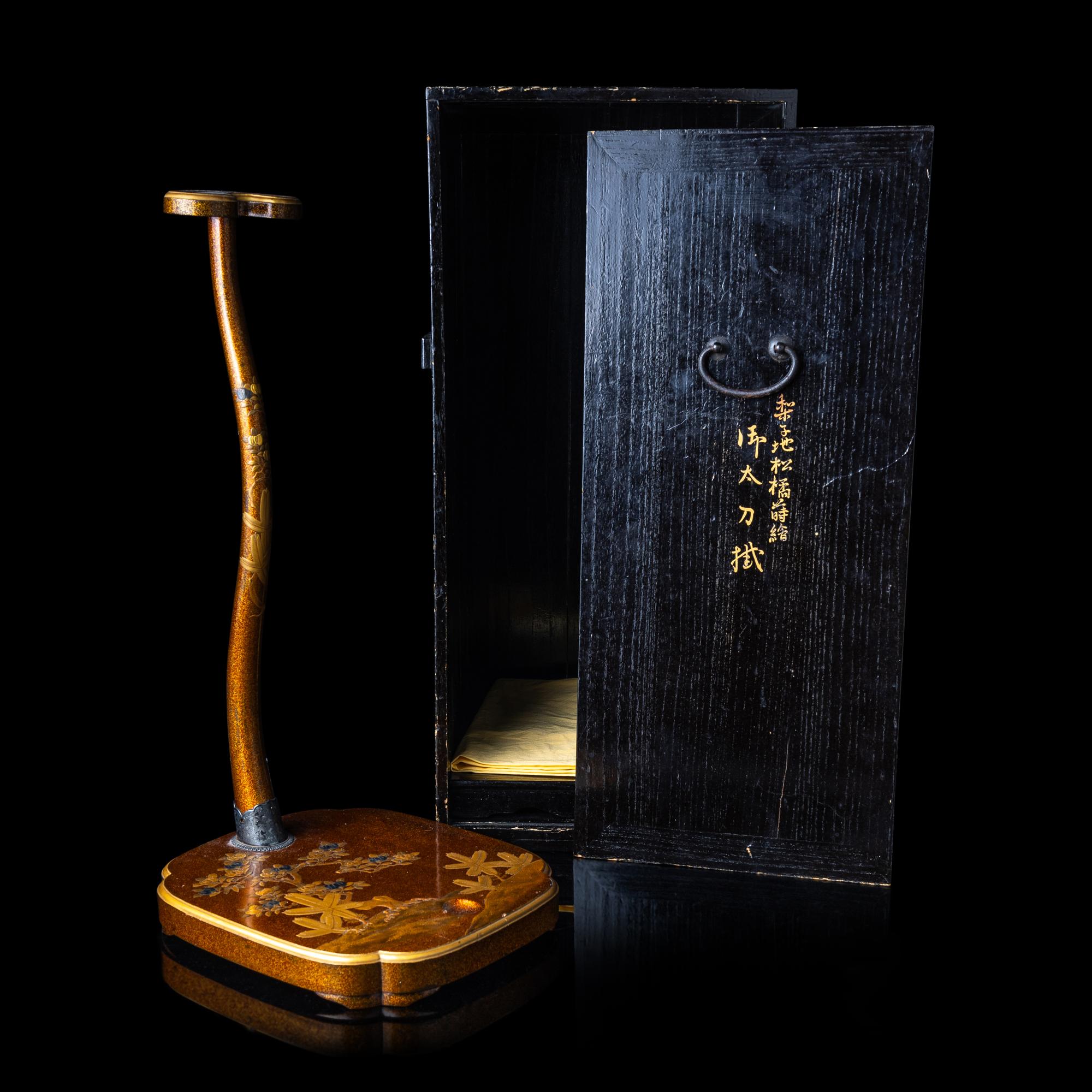 A Japanese Gold Lacquer Sword Stand, Tachi-kake, with Wood Box, Meiji Period 日本明治時期 梨子地松橘蒔繪太刀拵