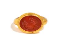 A Roman Carnelian Ring Stone with the God Silenus Surprising a Sleeping Woman — Set in a gold ring