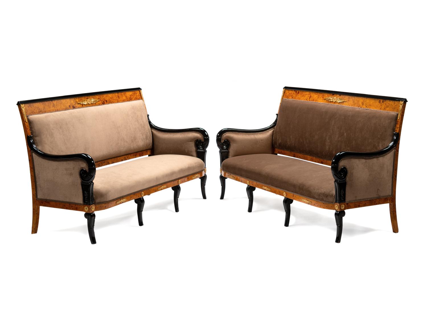 A Pair of Directoire Style Parcel Ebonized Burlwood Settees