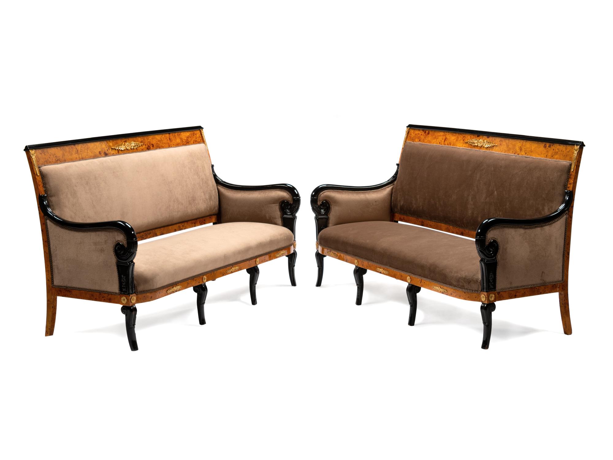 A Pair of Directoire Style Parcel Ebonized Burlwood Settees