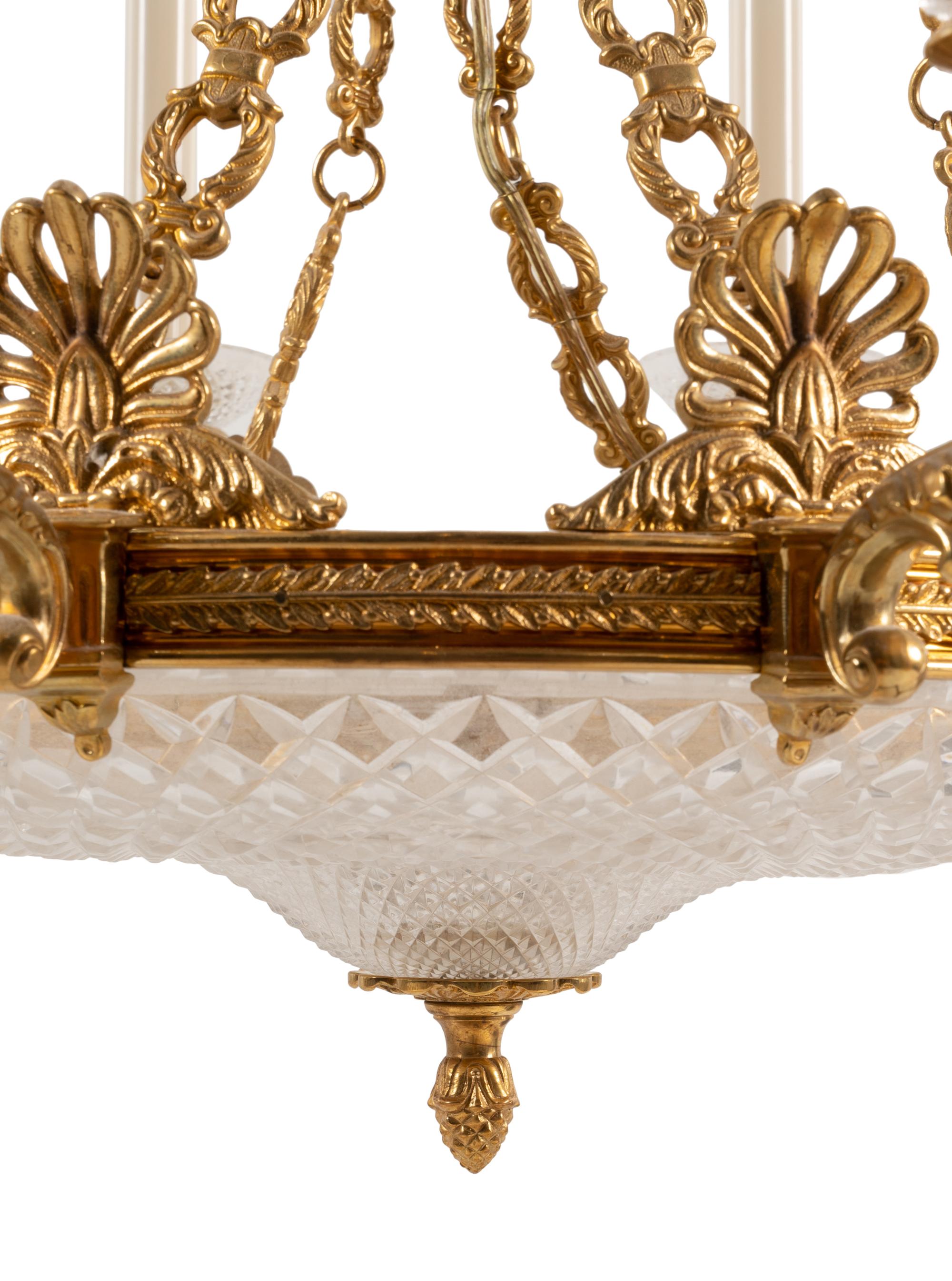 An Empire Style Gilt Metal and Cut Glass Eight-Light Chandelier