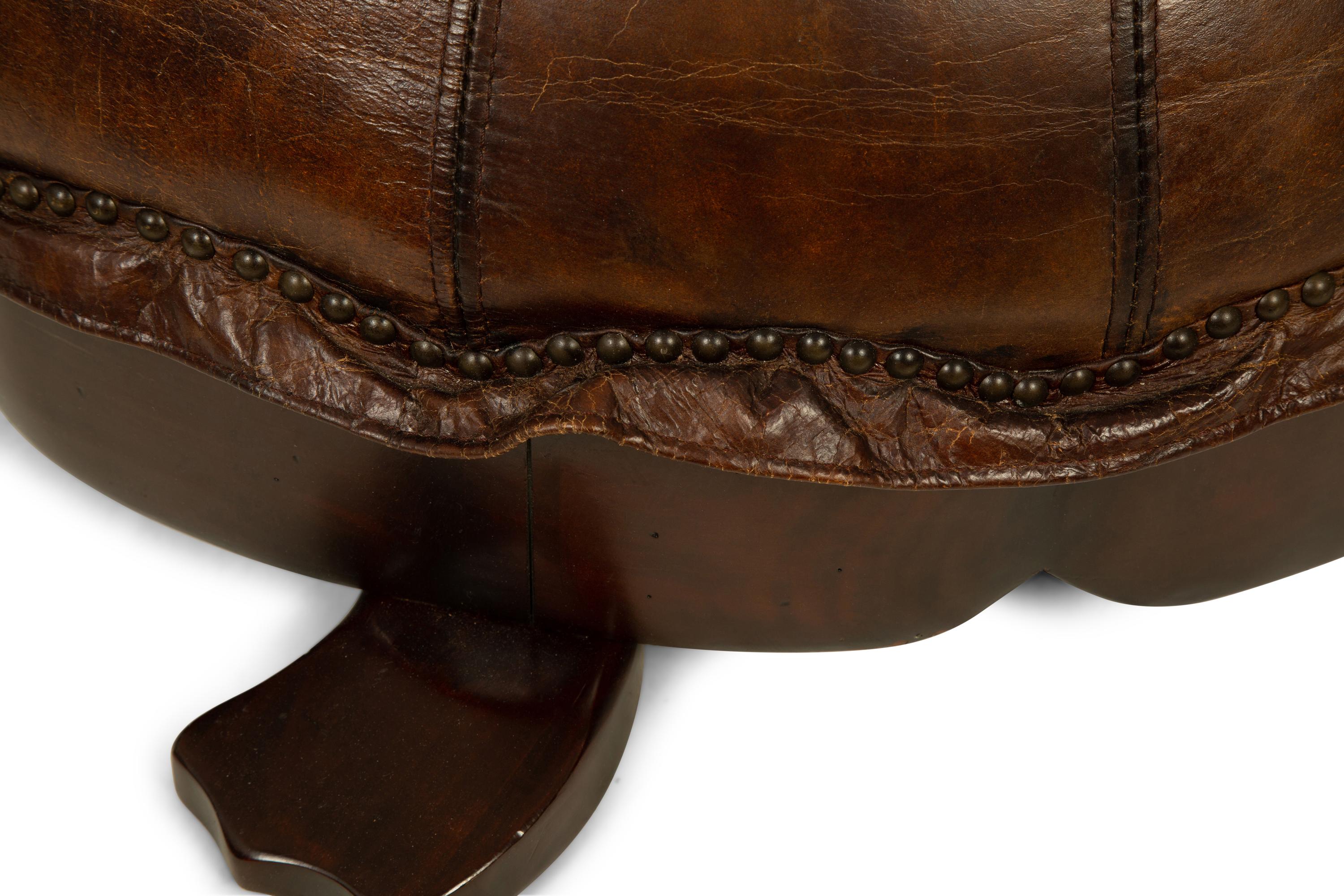 A Carved Wood and Leather Turtle Foot Stool — LATE 20TH CENTURY