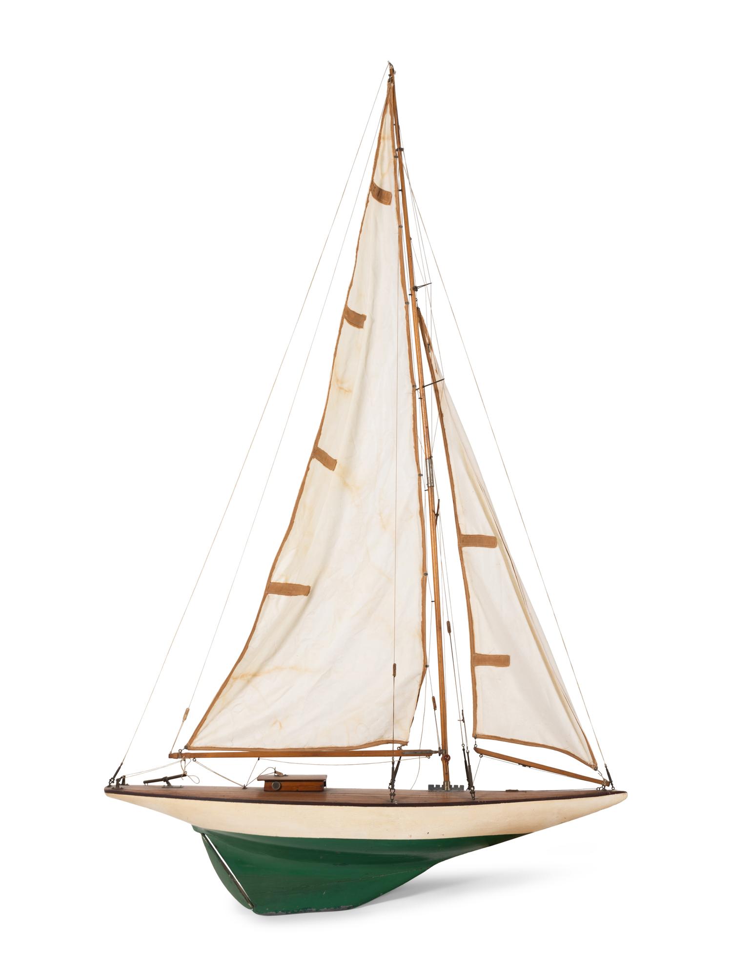 A Carved Wood and Linen Pond Boat