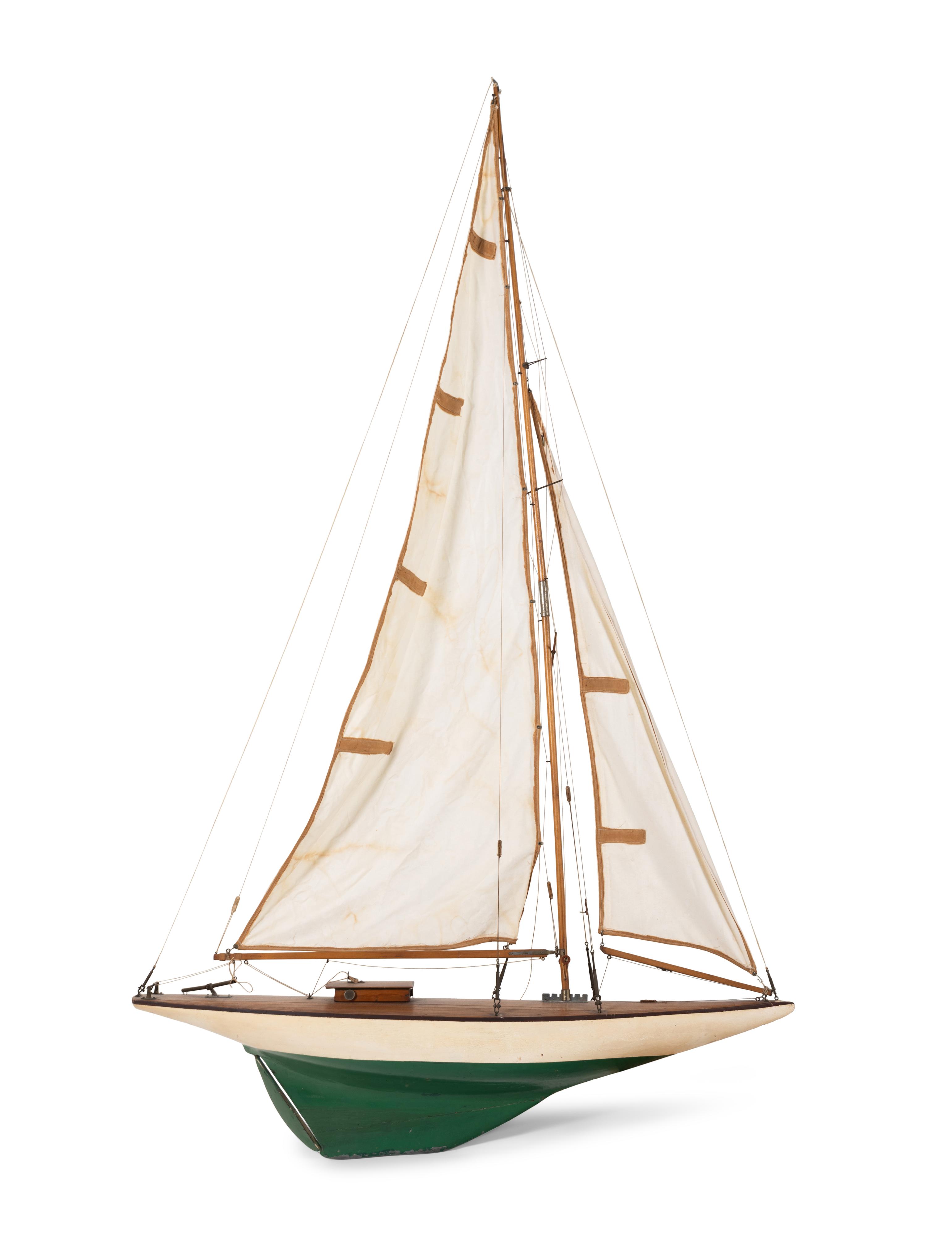 A Carved Wood and Linen Pond Boat