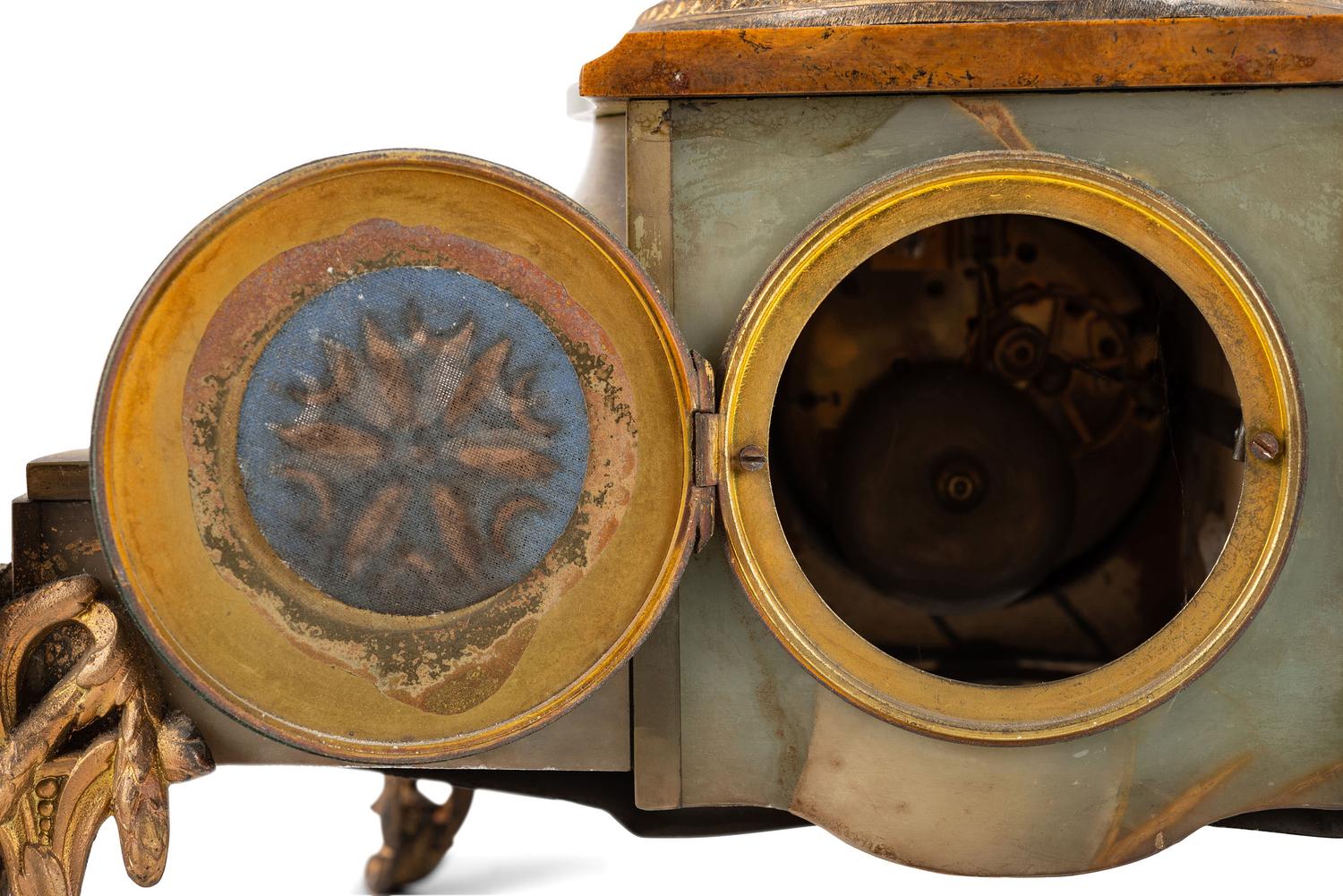 A Neoclassical Gilt Metal and Onyx Clock Garniture
