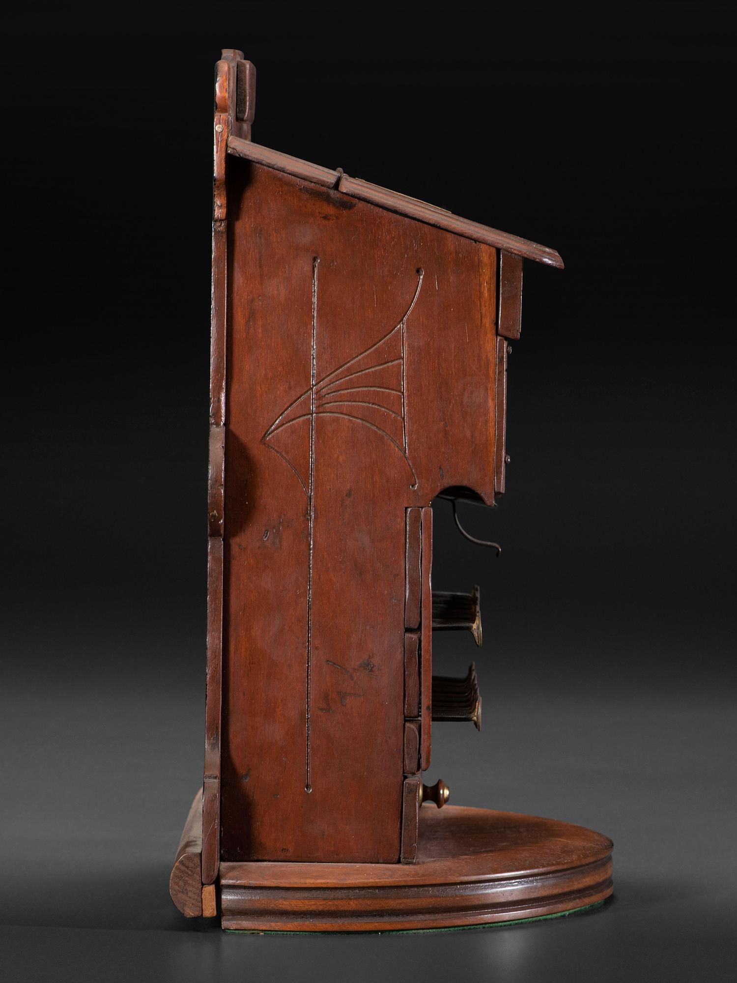 A Carved Wood Change Machine