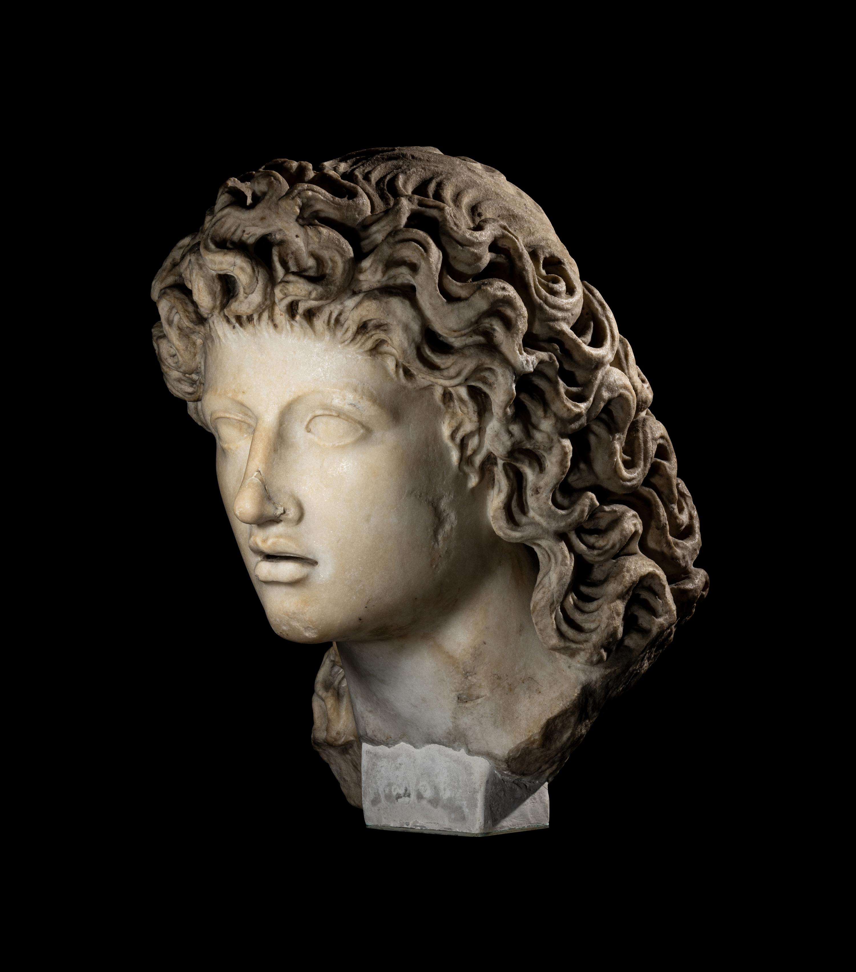 A Roman Marble Head of a Triton