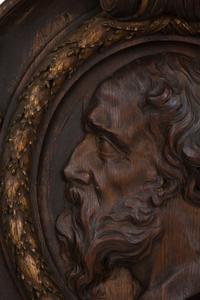 A Pair of Continental Carved Oak and Parcel Gilt Profile Plaques