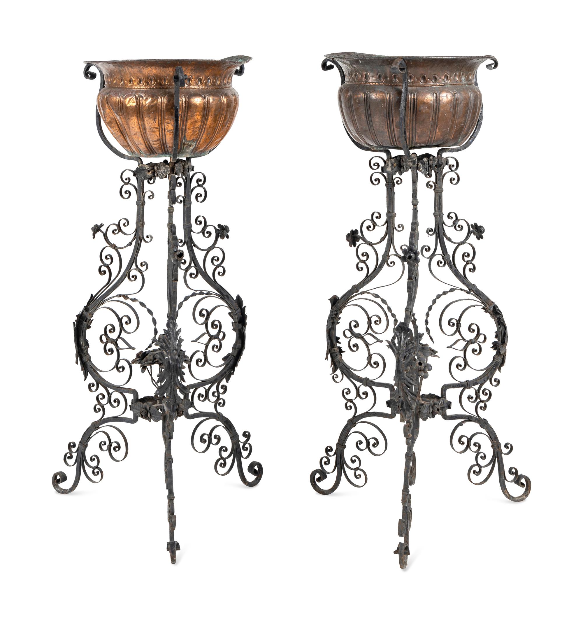 A Pair of Copper Jardinières on Black-Painted Wrought Metal Stands