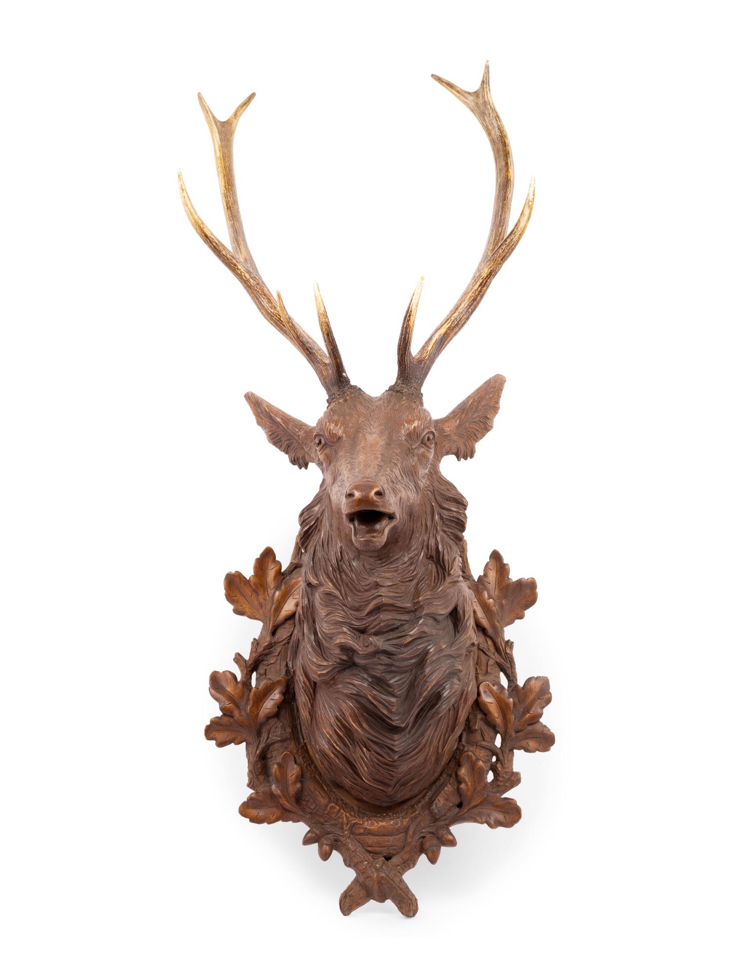 A Black Forest Carved Stag Head