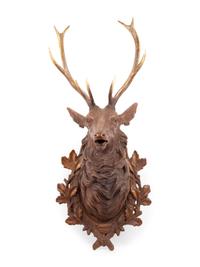 A Black Forest Carved Stag Head