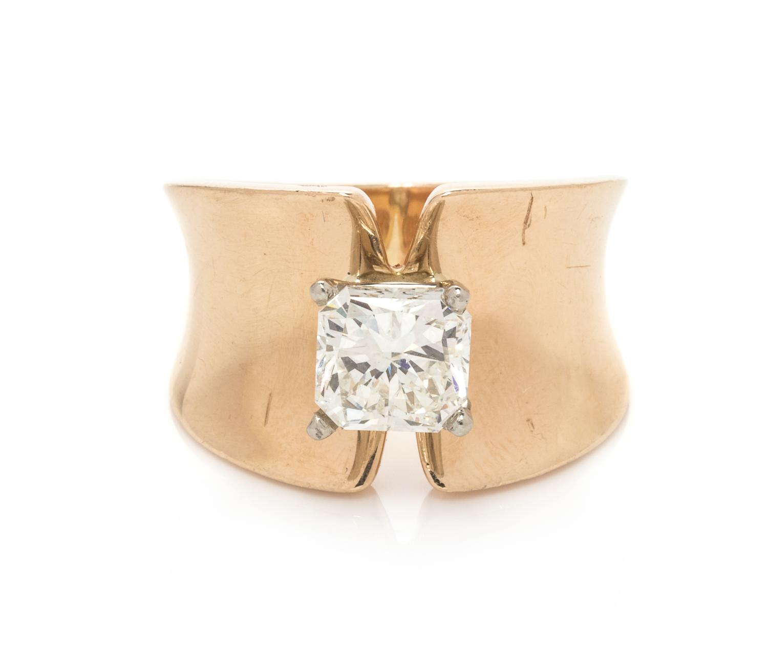 A 14 Karat Yellow Gold and Diamond Ring,